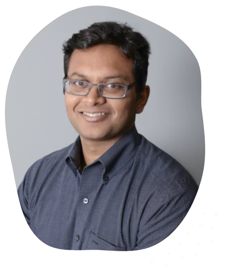 Portrait of Dr. Prashant Singri smiling in a collared shirt